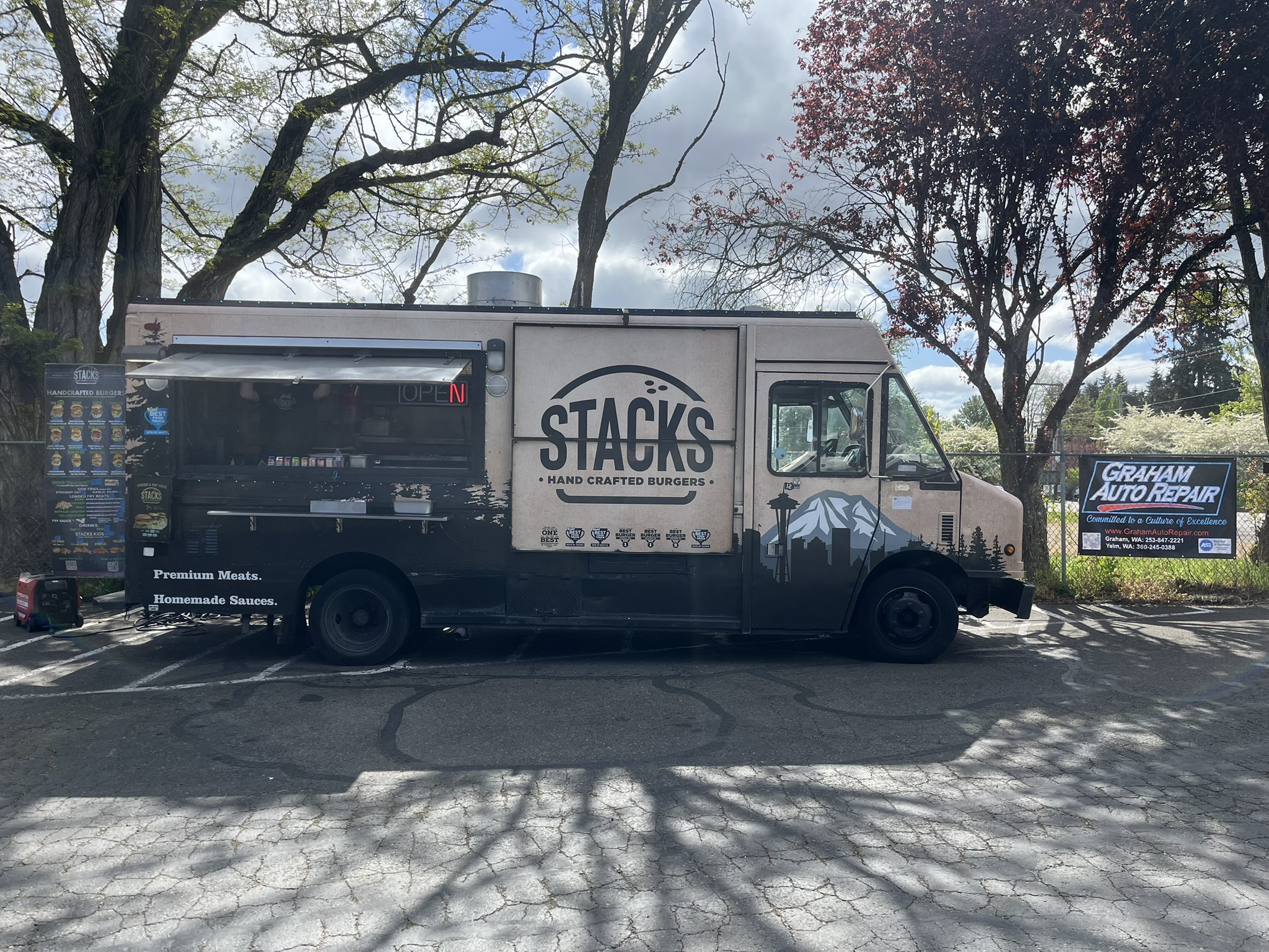 Stacks Burgers parked outside Graham Auto Repair in Yelm, WA, with ASE Blue Seal sign visible